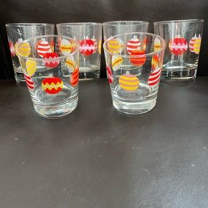 Six IKEA glass Christmas ornament glasses.